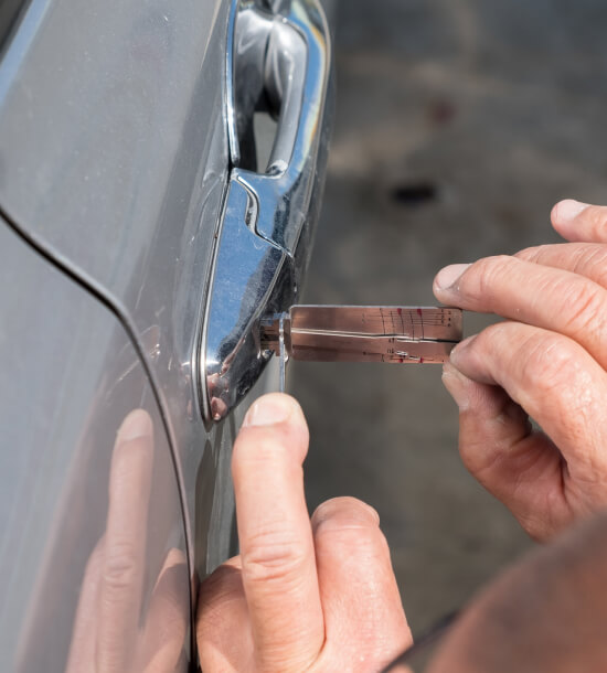 Auto locksmith in Waco unlocking a car door