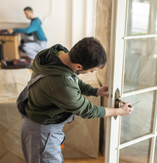 college-station-locksmith-installing-new-door-lock-img College Station locksmith installing a new door lock