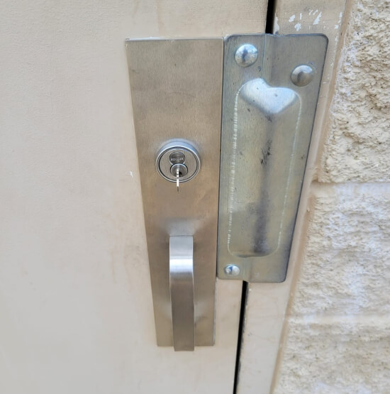 college-station-locksmith-securing-door-after-break-in-img College Station locksmith securing a door after break-in