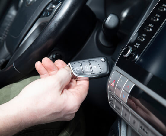 locksmith-holding-flip-car-key-fob-fort-worth-image Locksmith in Fort Worth holding a flip car key fob