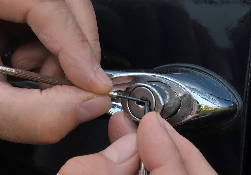 Mobile locksmith opening a locked car door without damage