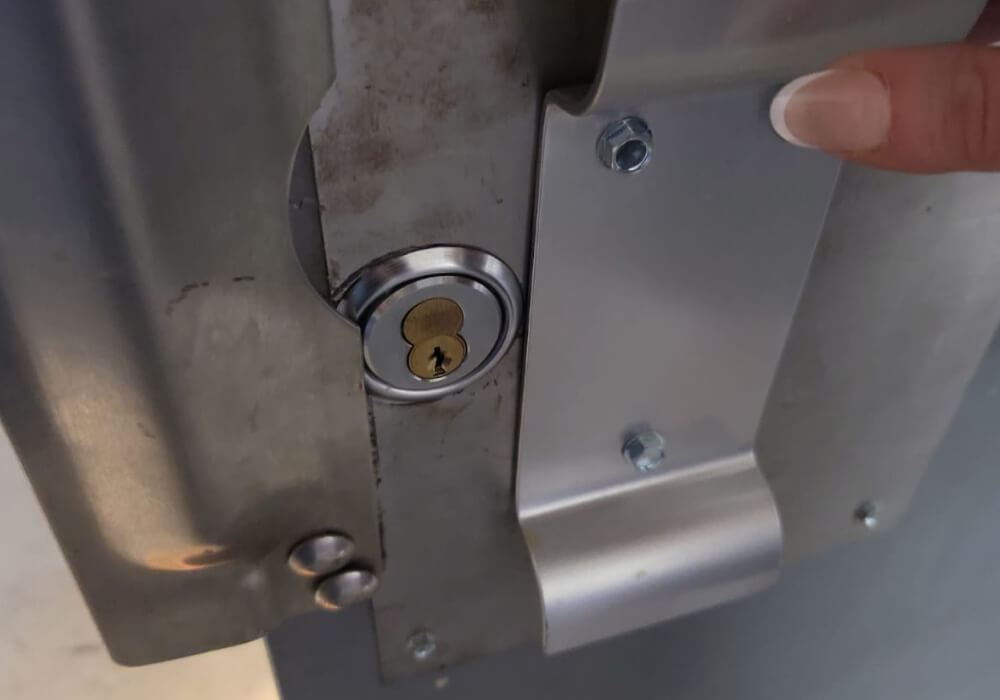 Commercial locksmith fitting rim cylinder lock with latch guard
