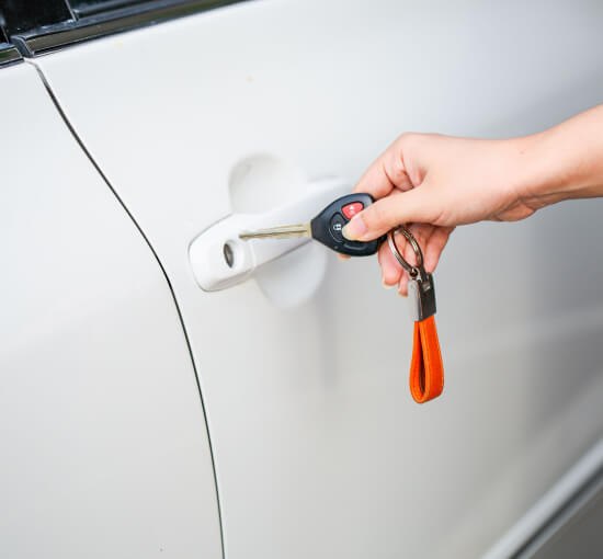 auto-locksmith-unlocking-car-door-austin-tx-image Auto locksmith unlocking a car door in Austin, TX