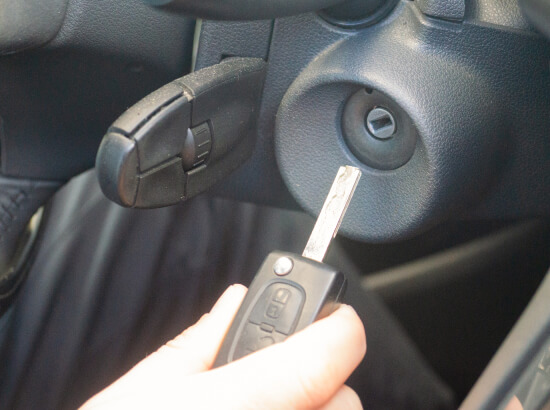 car-key-ignition-cylinder-dallas-replacement-img Car key held to an ignition cylinder during Dallas replacement