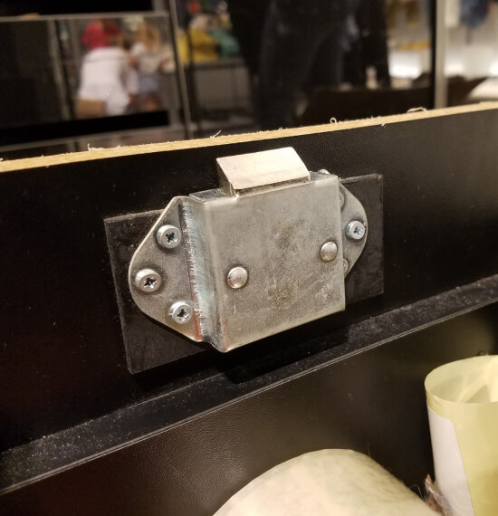Electric door lock mounted above a College Station entrance
